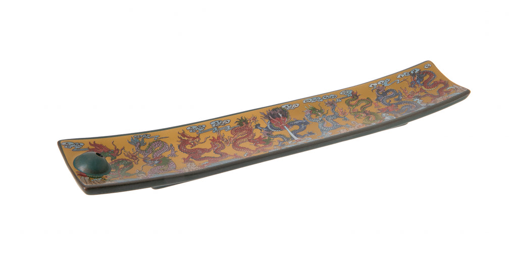 This vibrantly painted ceramic incense holder features no less than nine colorful dragons, on a golden yellow background. A pretty and practical stand for your favorite incense. Ceramic incense holder. Dimensions: 9" x 1.5" x 0.5".