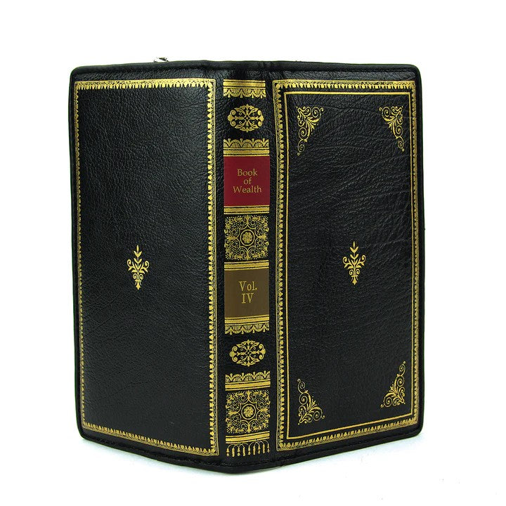 Flaunt your love of vintage books with this "Book of Wealth" wallet. Perfect for carrying by itself for quick errands and small enough to fit your tote bag. Includes 10 card slots and 1 ID pocket as well as 4 bill compartments. Dual magnetic clasp and zip around closure Dimensions: Approx. 8"x 1.5"x 4" Materials: Vinyl
