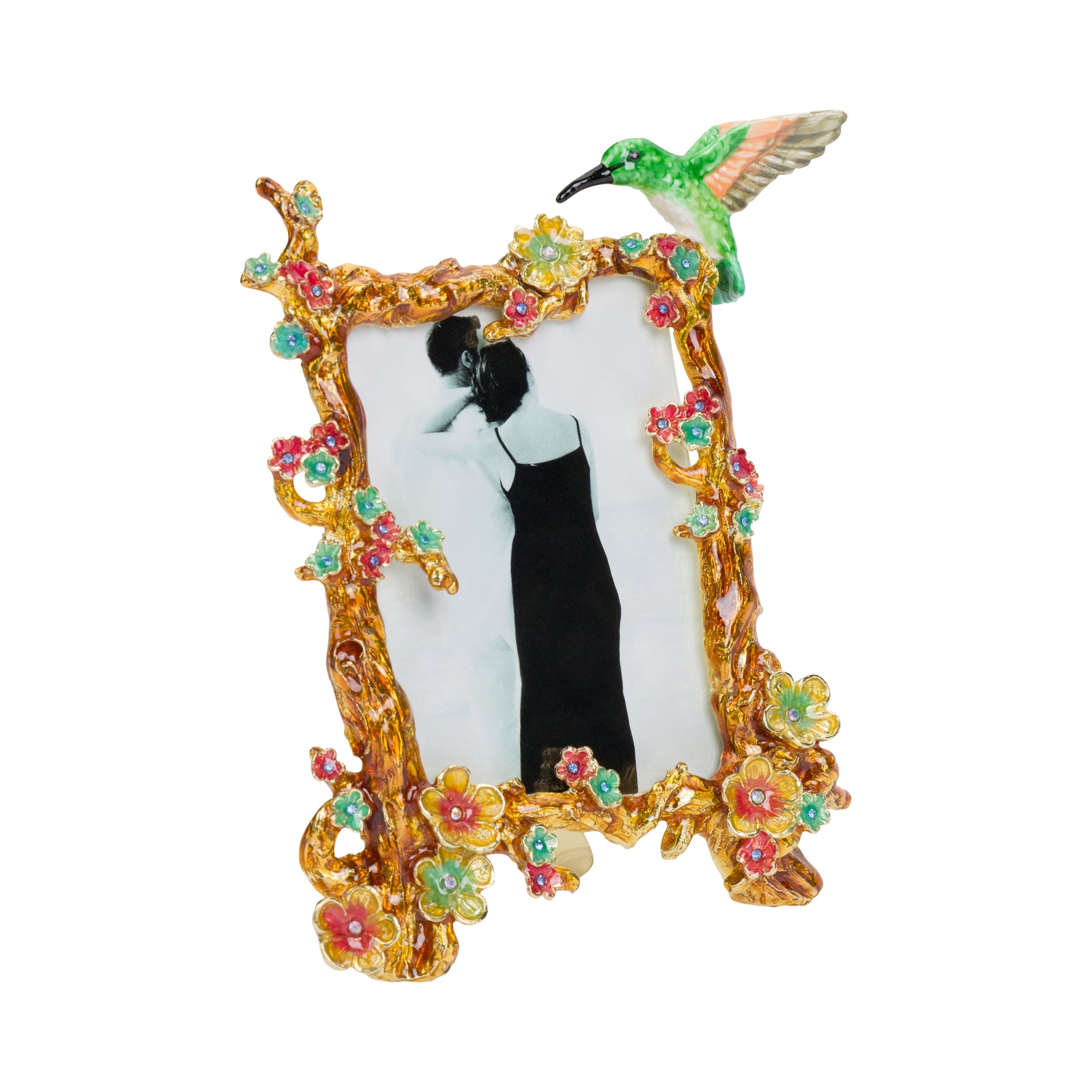 An ornate gold picture frame decorated with colorful flowers and a green hummingbird at the top, holding a black-and-white photo of a couple.