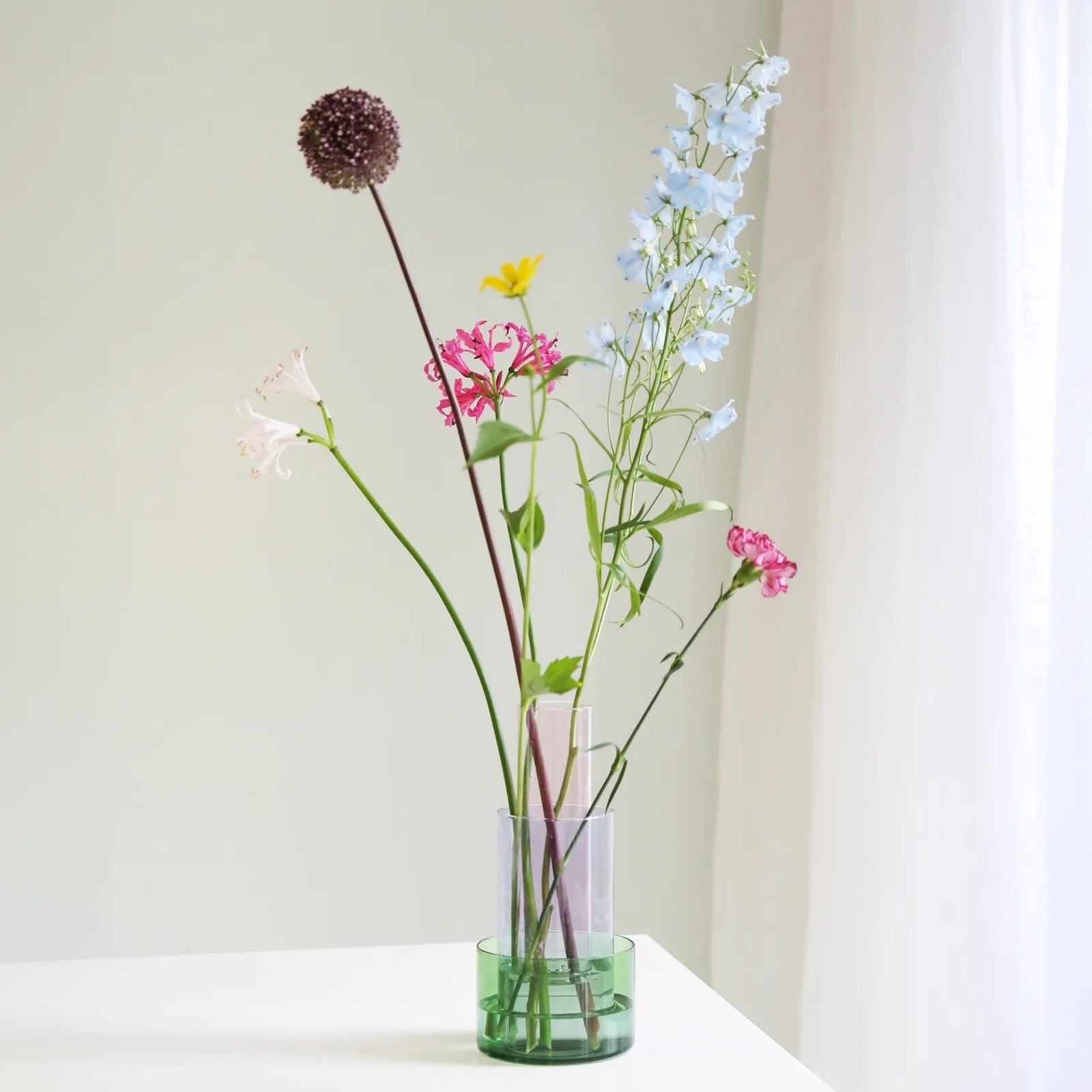 Glass vase with three-tone design on a white background