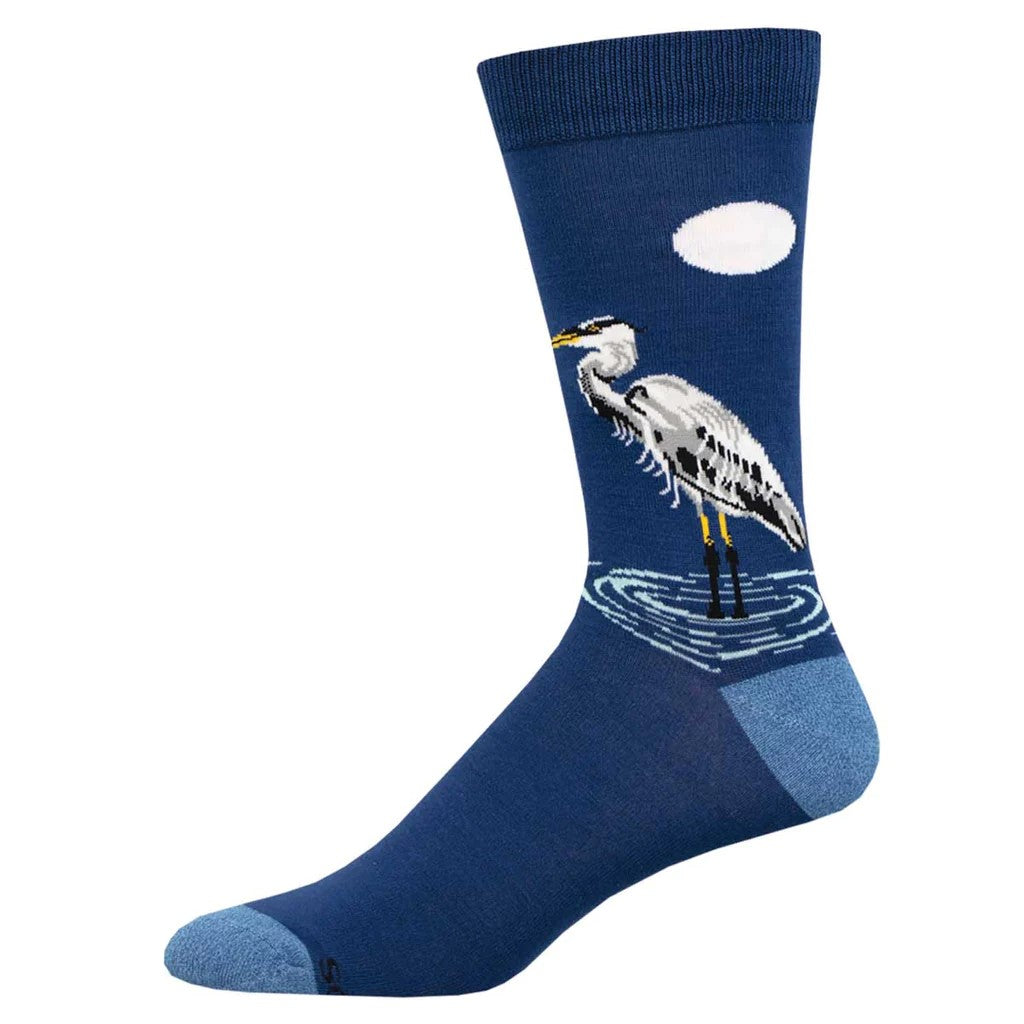 Grab a pair of these delightful socks, or you may just r-egret it! These stupendous socks feature a lone Egret dipping its feet into a lake at moonlight. One glance at this serene scene and you'll feel instantly calm. Size: L/XL 10-13 (Women's Shoe Size 10.5+ and Men's Shoe Size 9-13) Made using rayon from bamboo.