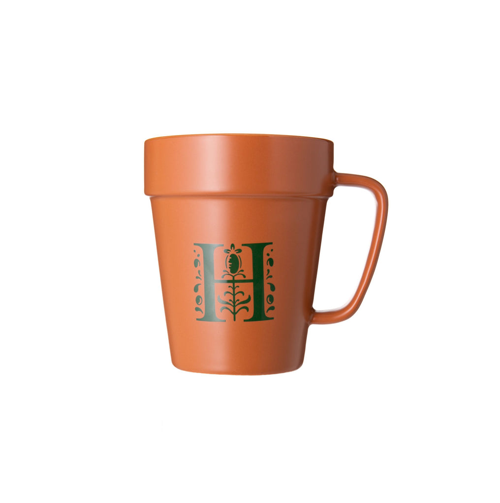 Enjoy sipping your coffee or tea from this mug designed to look like a terracotta plant pot! Printed with The Huntington's iconic 'H' logo. Exclusive to The Huntington Store Hand wash only Microwave safe