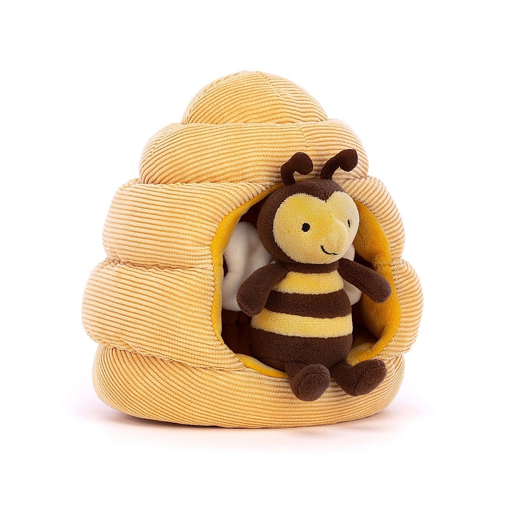 Honeyhome Bee is a smiling friend in chocolate and caramel stripes. This sweet little bee has bobbly feelers, a perky nose and soft beige wings. They live in a snuggly quilted cord hive but can pop in and out anytime! Dimensions: 7" x 7". Suitable from birth.