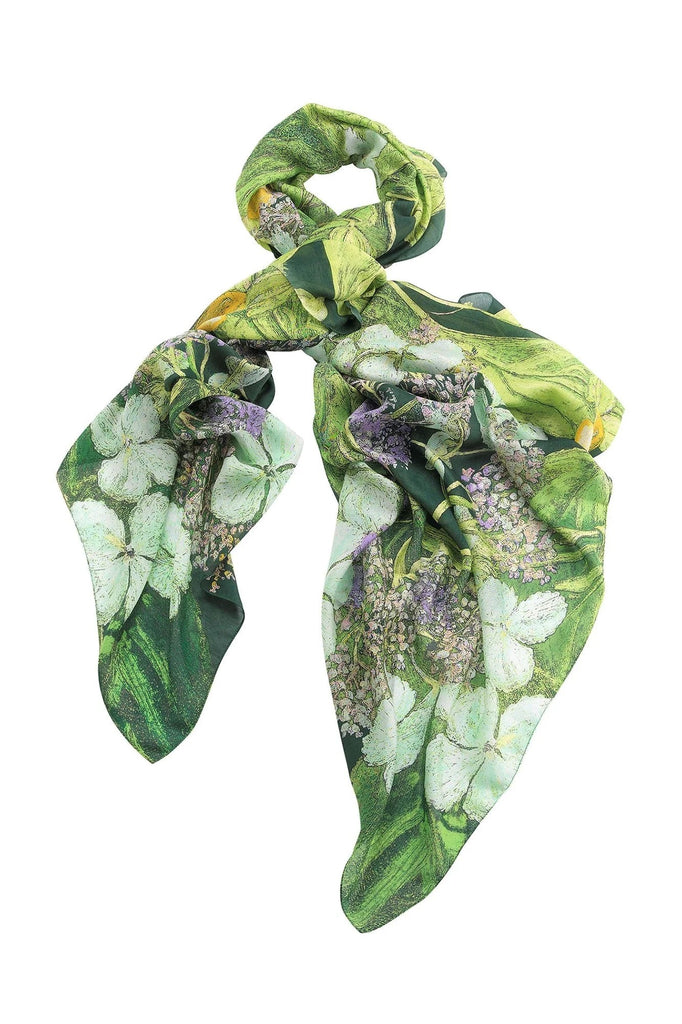 This Hydrangea print scarf takes inspiration from Marianne North's archive of paintings and samples, which are held by the Royal Botanical Gardens at Kew, England. This soft, lightweight scarf is a generous size, making it perfect for layering in the winter months or worn as a cover up during the summer. 39" x 79" .