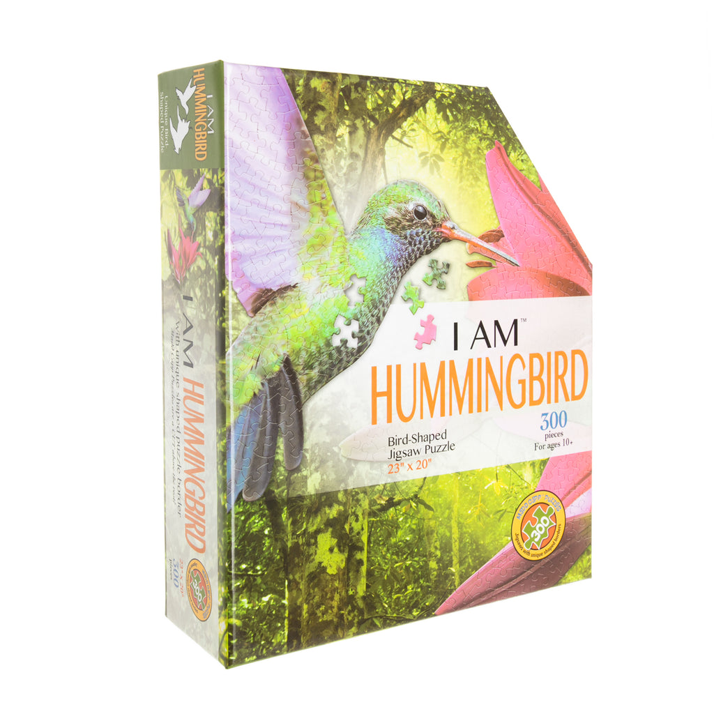 The border of this striking and unique puzzle follows the beautiful design of a hummingbird feeding from pink lilies. Its randomly cut, interlocking puzzle pieces have a quality, high gloss finish. 300-piece puzzle. Finished size is 23"L x 20"H. Ages 10-adult.