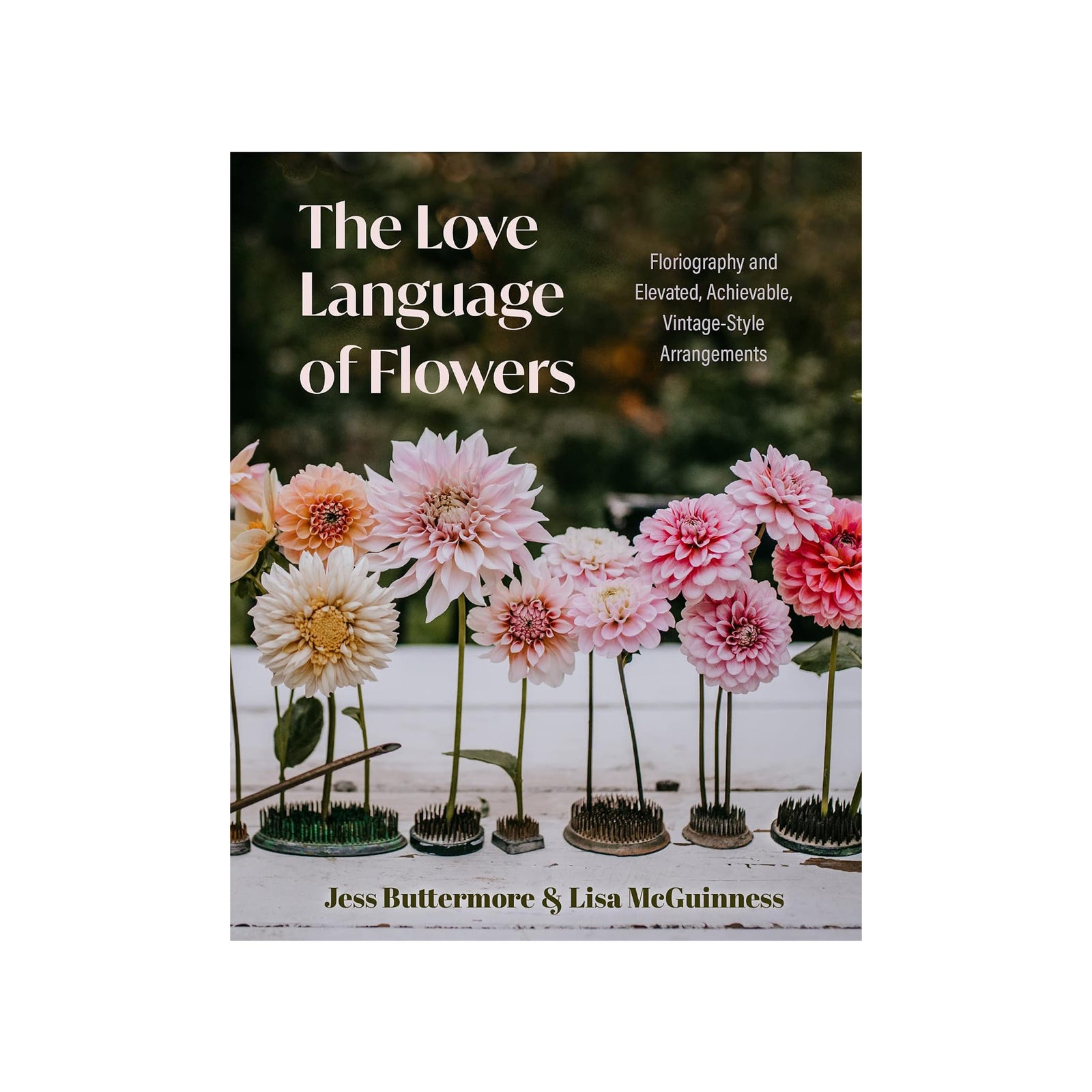 The Love Language of Flowers book cover, featuring a photograph of pink and white dahlia flower arrangements in small pots against a dark green background. The title is written in large white text at the top, with the authors' names, Jess Buttermore and Lisa McGuinness, at the bottom.