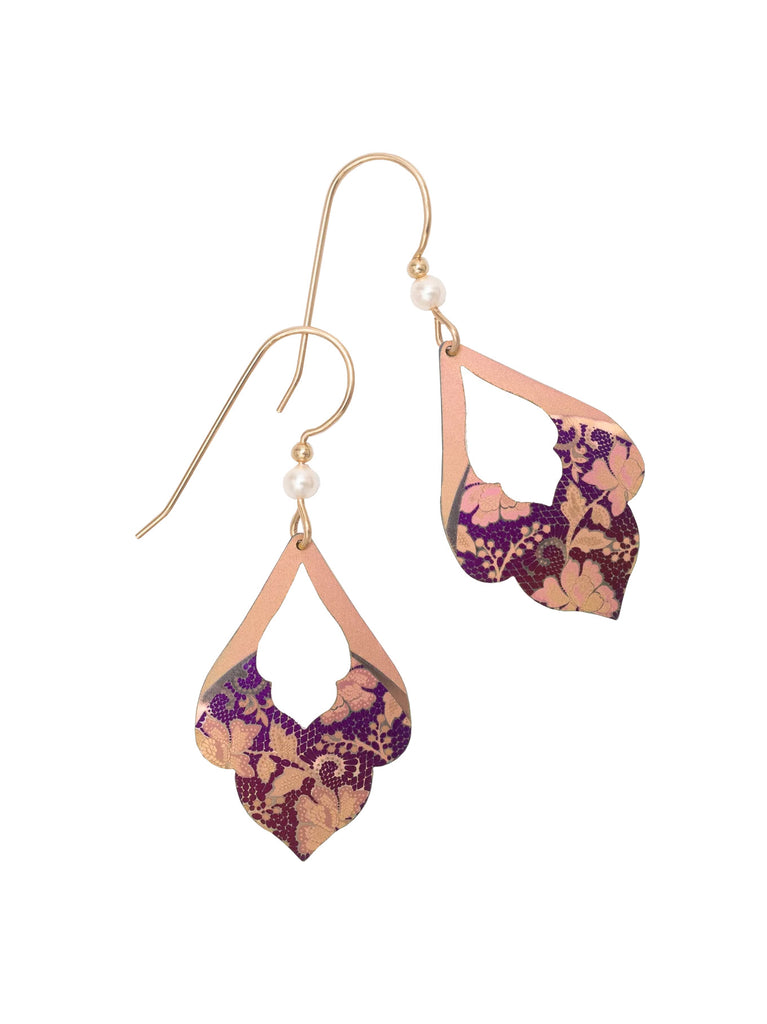 If you're looking to add a subtle floral finishing touch to your outfit, then these are the earrings for you. They feature a scalloped edge and are etched with an Arts & Crafts style floral design in purple and blush pink on a rose gold colored base. Materials: Niobium. Gold filled ear wires. Dimensions: 1.5" x 0.75".