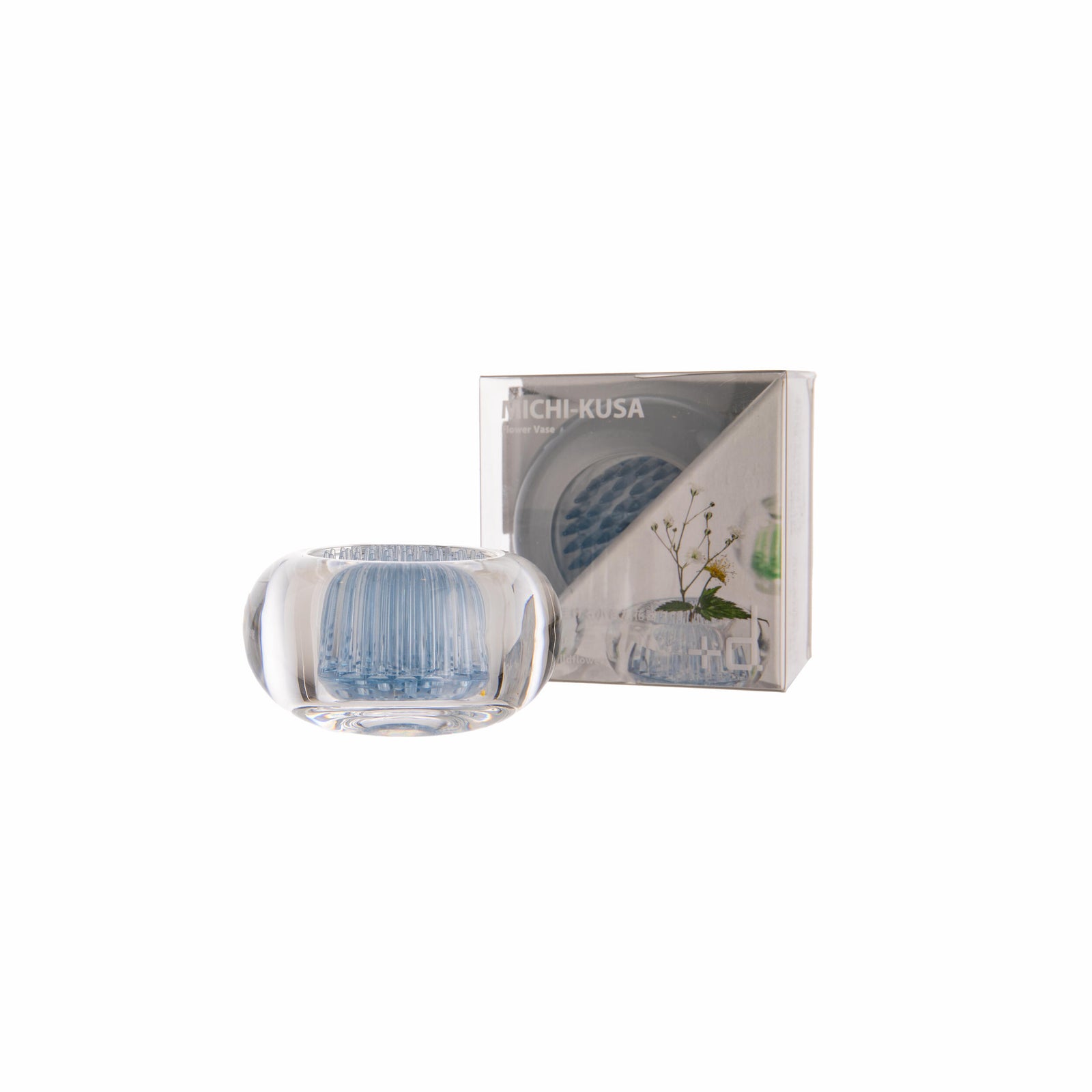 Clear glass Ikebana flower arranging holder with packaging on a white background