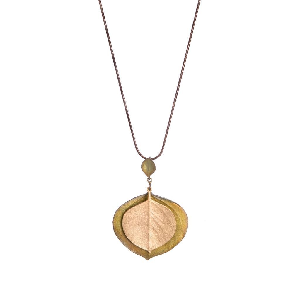 Native to Australia, the eucalyptus is a genus of over 700 species, ranging from handsome landscape trees to large shrubs. Known for their aromatic leaves which are the primary source of eucalyptus oil. Materials: bronze, brass, 24kt gold plating. Dimensions: Chain: 19" to 21". Pendant: 2" x 1.5".
