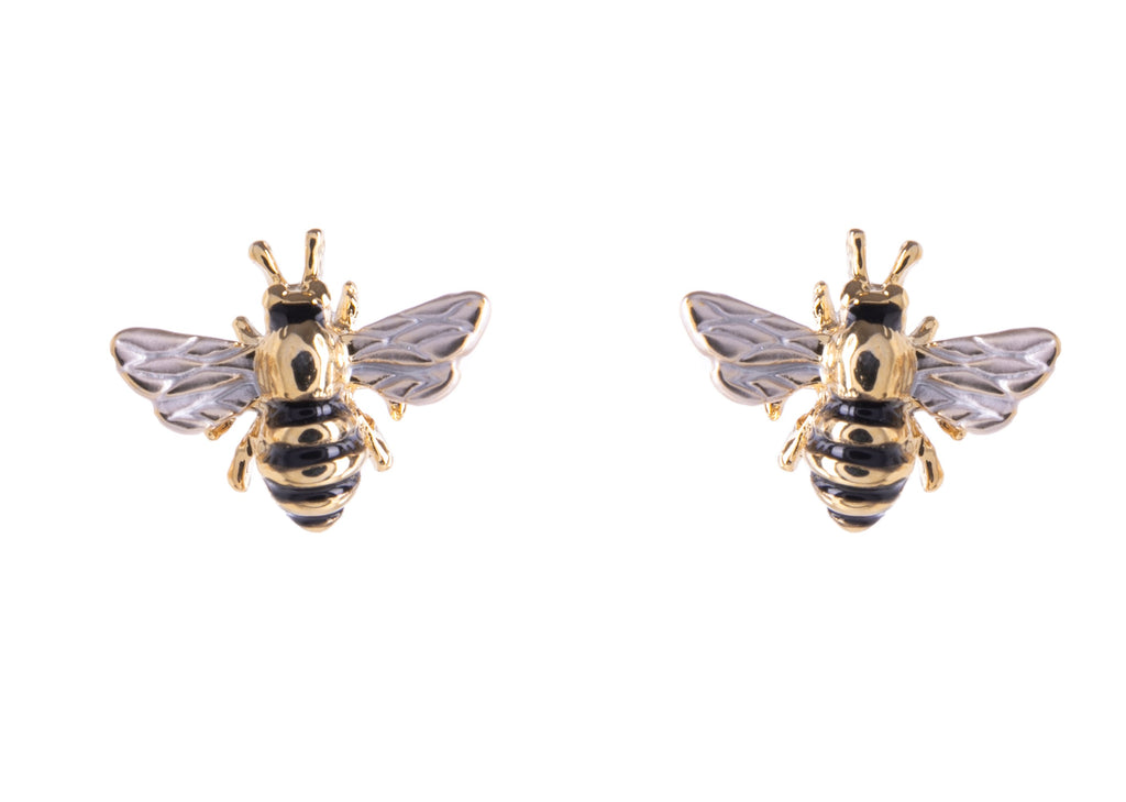 A pair of cute and quirky bee studs with soft enamel detailing over polished 18ct gold plating. The titanium posts and butterfly push backs make securing and wearing these lightweight earrings simple and comfortable. Materials: 8ct gold plated brass, enamel, titanium posts Dimensions: 0.5" x 0.4".