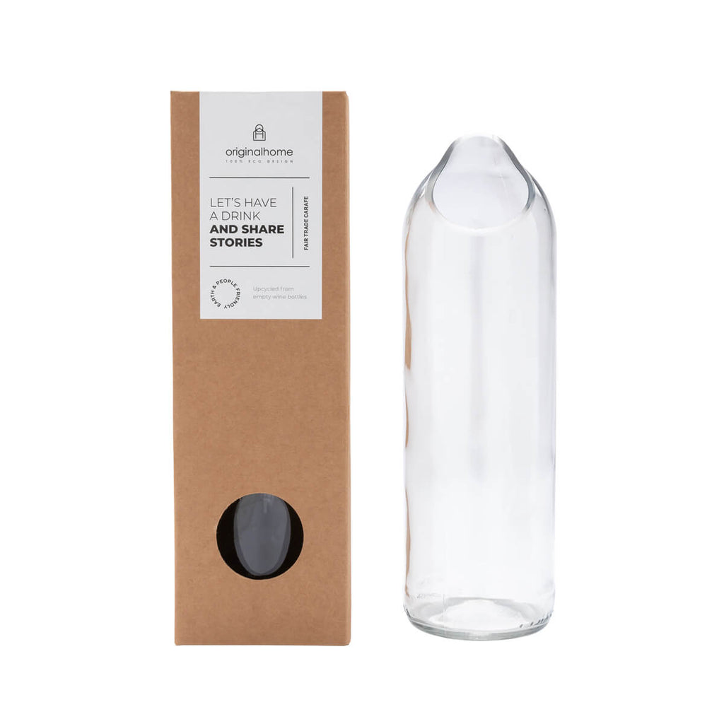 This simple glass carafe is made in an 'upcycling' workshop from recycled wine bottles. 100% handcrafted from recycled wine bottles. Low impact production process. Ethically and socially responsible. Packed in a presentation box.