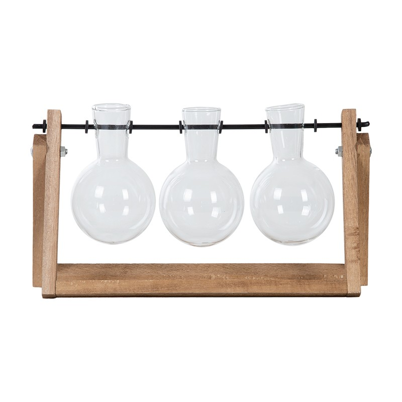 Floral arrangement in glass vases on a wooden stand with a white background