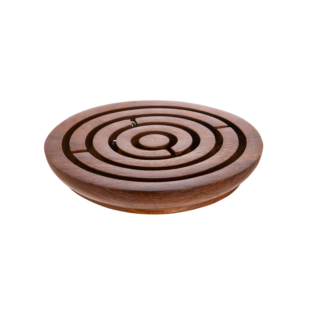 Test your focus and patients as you strategize how to maneuver multiple metal beads to the center of a maze. Rosewood & metal beads Hand Carved Diameter: 6”, Height: 0.5" Please note: game has small parts and is not suitable for small children