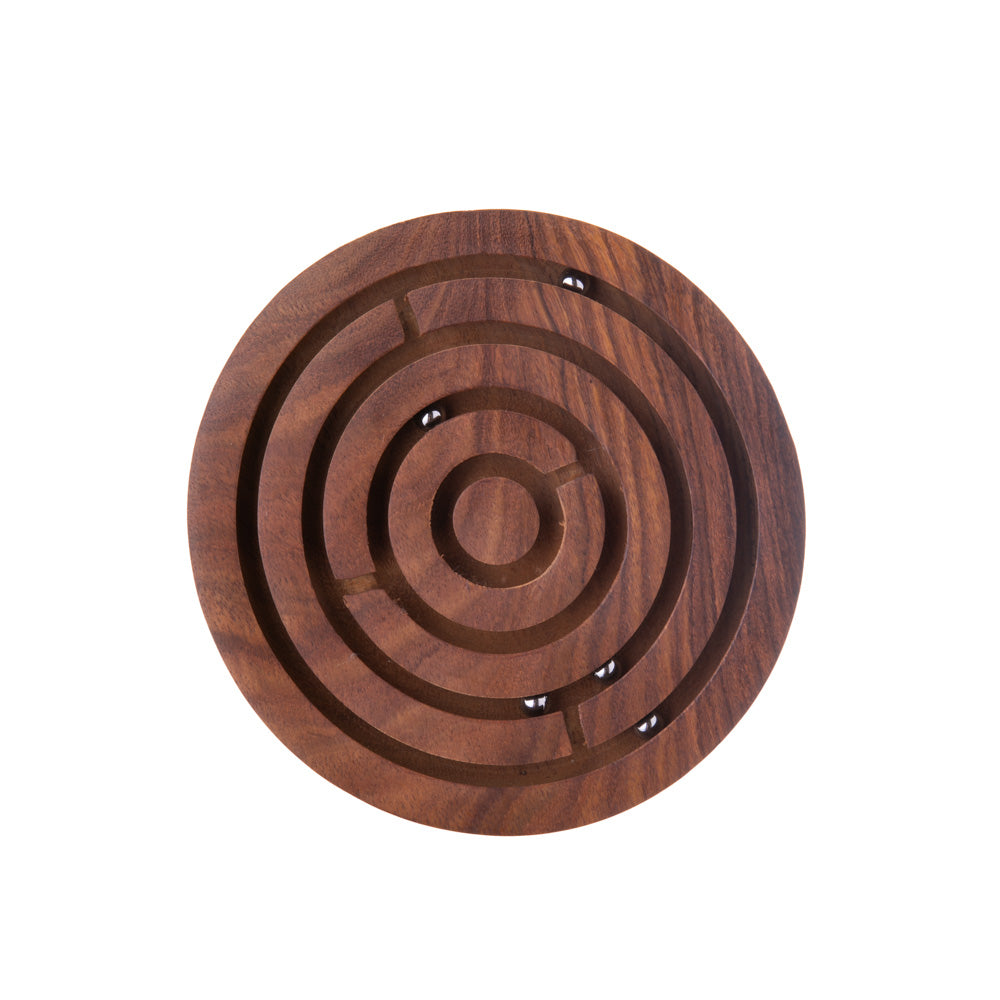 Test your focus and patients as you strategize how to maneuver multiple metal beads to the center of a maze. Rosewood & metal beads Hand Carved Diameter: 6”, Height: 0.5" Please note: game has small parts and is not suitable for small children