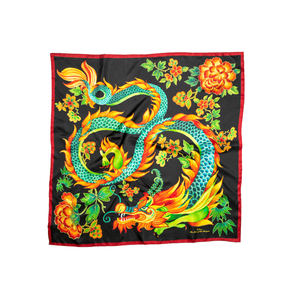 Wrap yourself in elegance this Lunar New Year with our stunning silk scarf featuring a magnificent dragon design. Celebrating the Year of the Dragon, its vibrant colors and intricate details bring luck and prosperity. Perfect for adding a touch of tradition and style to any outfit.  100% silk. 35 in. x 35 in.