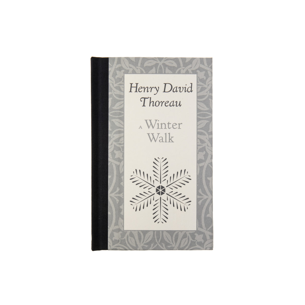 A book titled &#39;A Winter Walk&#39; by Henry David Thoreau, featuring a simple design with a snowflake on the cover.