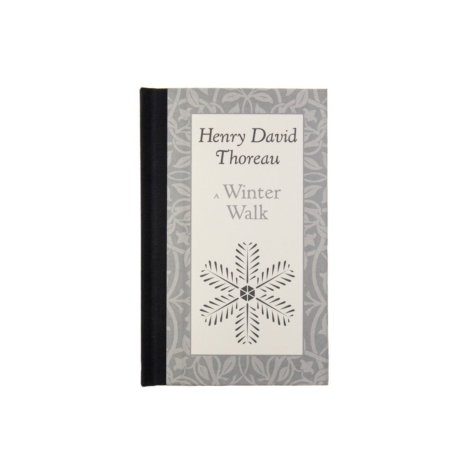 A book titled 'A Winter Walk' by Henry David Thoreau, featuring a simple design with a snowflake on the cover.