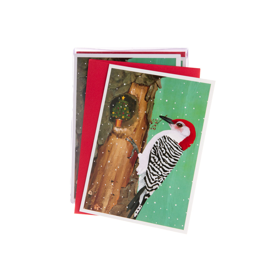 This delightful Christmas card showcases a lively woodpecker nestled among the branches of a jolly Christmas tree, ready to “peck” in the holiday spirit! 