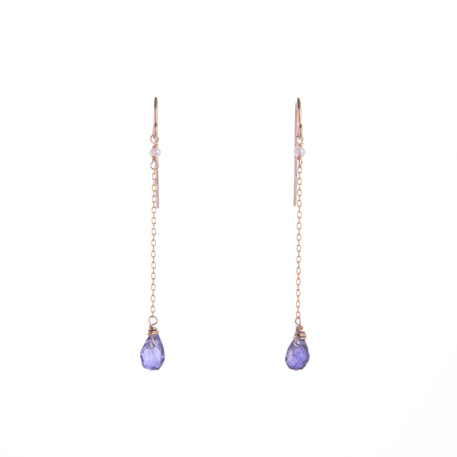 Iolite is said to be good for self-love and a strong intuition. Wear these Iolite dangle earrings to add a dose of self-love and subtle glam to any look. With a subtle crystal pearl detail and gold fill chain, these earrings will look great day or night. Dimensions: 1.5" Length from hook Material: 14ct Gold Fill