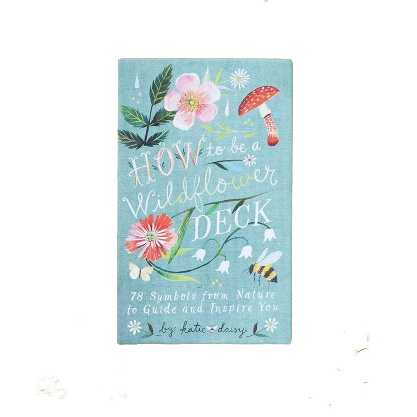 Boc cover of 'How to be a Wildflower' card deck with floral illustrations on a blue base, on a white background.
