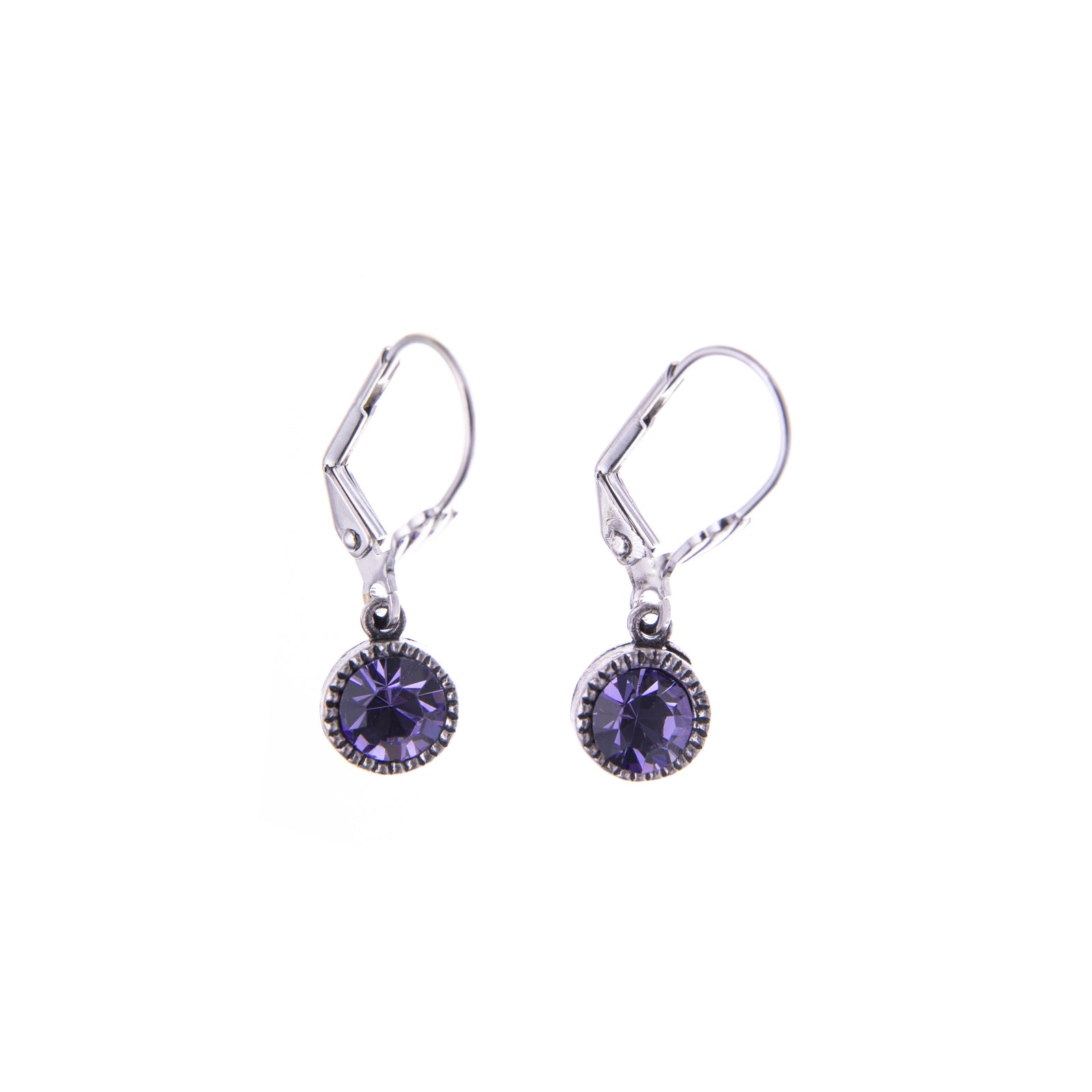 These bezel set dangle earrings with tanzanite crystal detail and leverback clasp are gorgeous and practical enough to be a regular in your jewelry rotation. A wonderful gift for anyone looking for some subtle glam. Material: Sterling Silver Dimensions: Approx. 1" Length Lead and Nickel-free