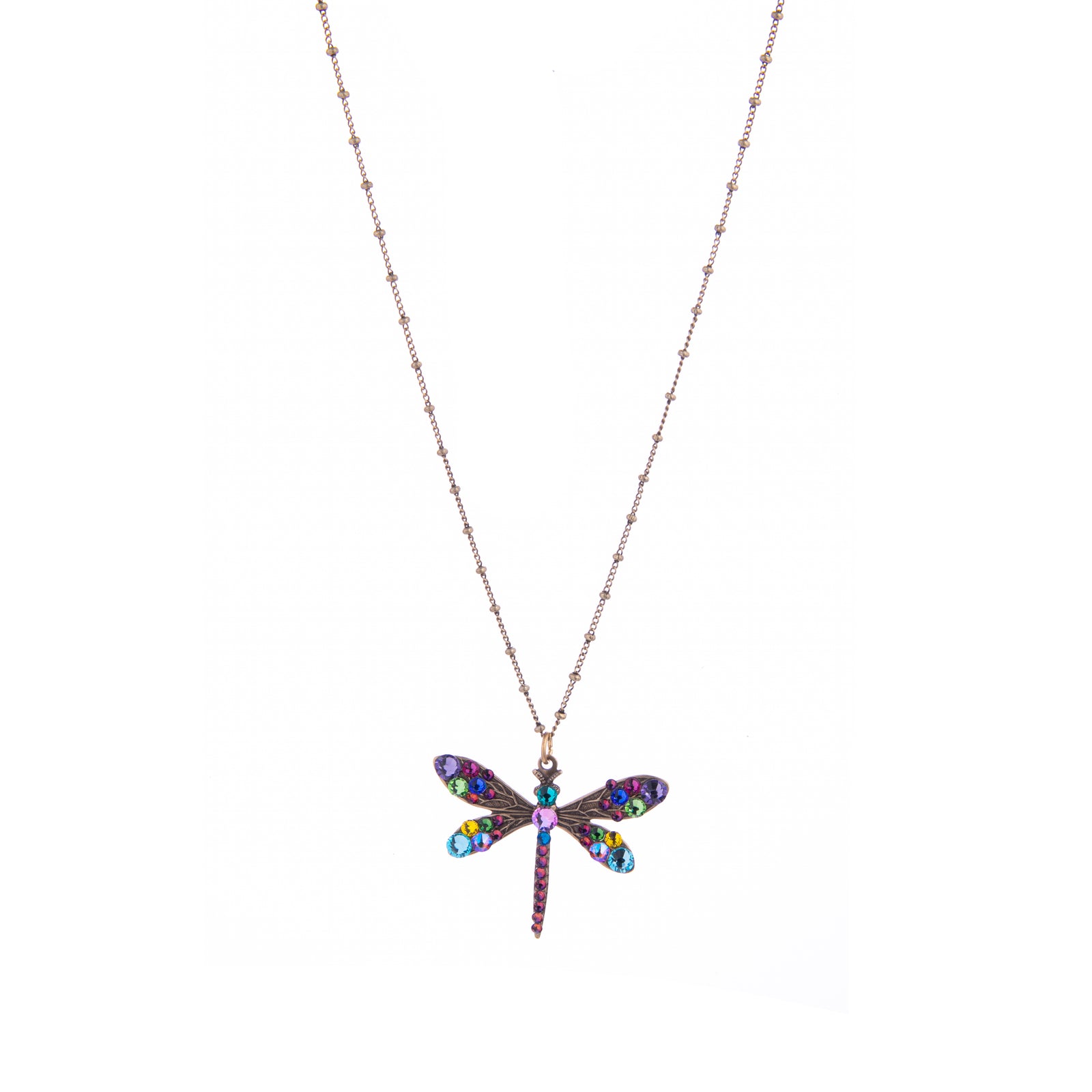 This Dragonfly Necklace with multi-colored crystal detail and intricate metalwork and its rainbow-colored sparkle will look truly special and stand out against any color you wear with it.  Material: Antiqued brass Dimensions: Approx. 1" Pendant, Adjustable Chain 16”-18" Lead, Nickel-free Lobster claw closure