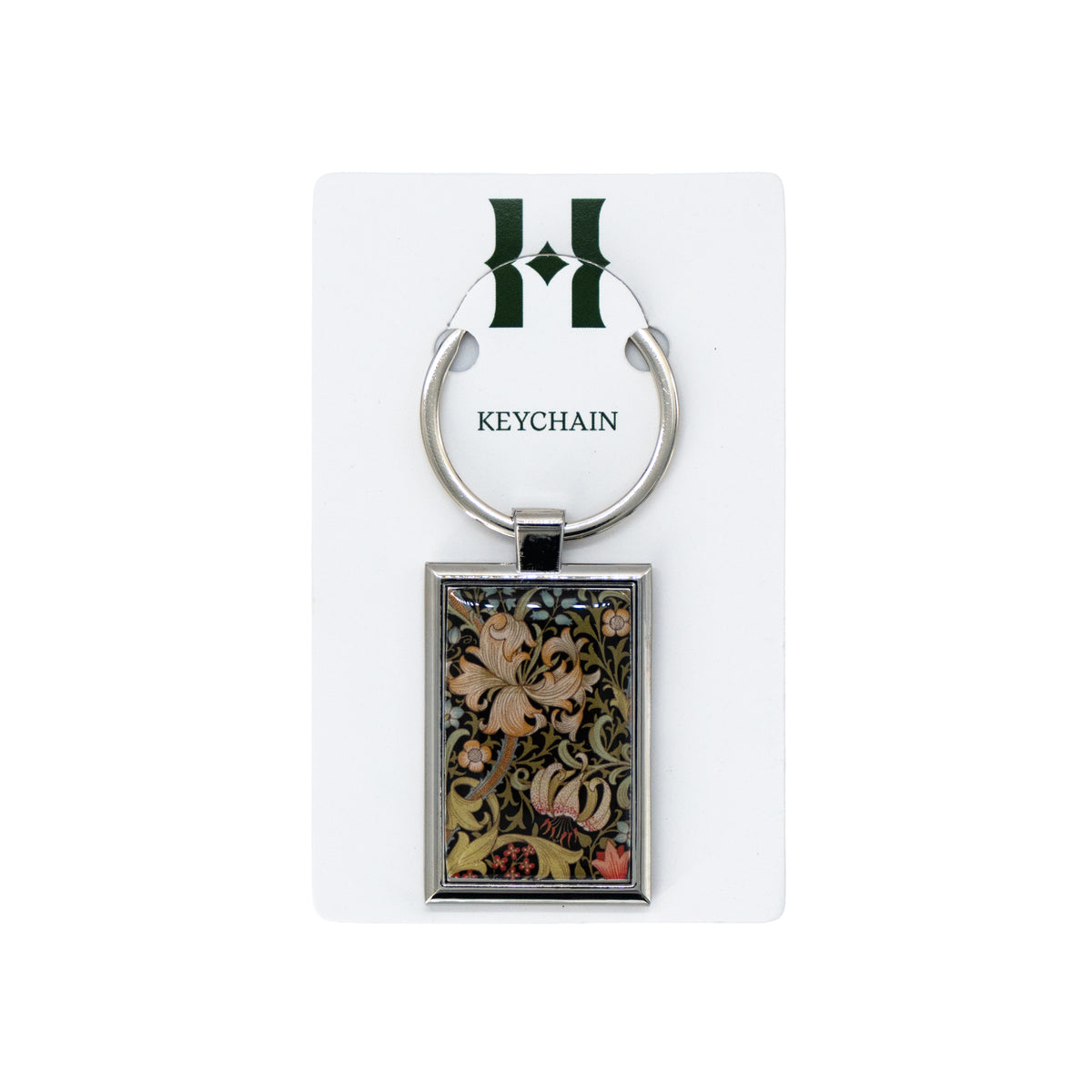 Keychain with floral design on a white card with 'H' logo