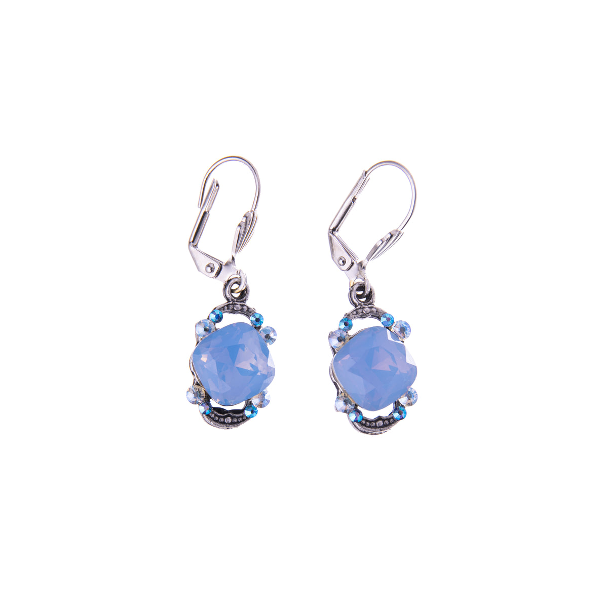 Pair of earrings with blue gemstones on a white background