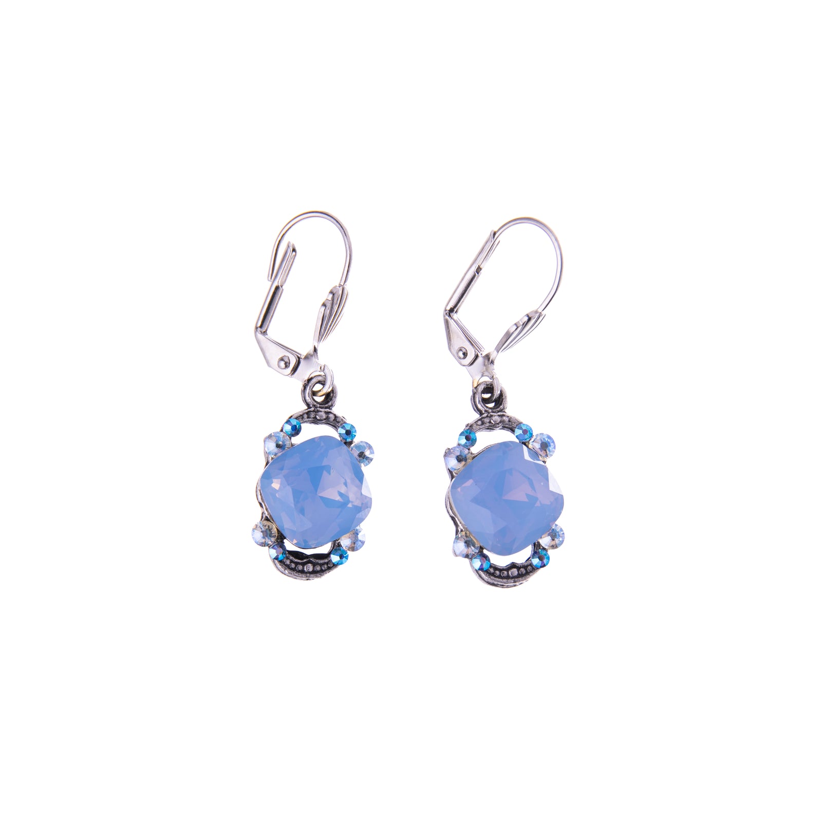 Pair of earrings with blue gemstones on a white background