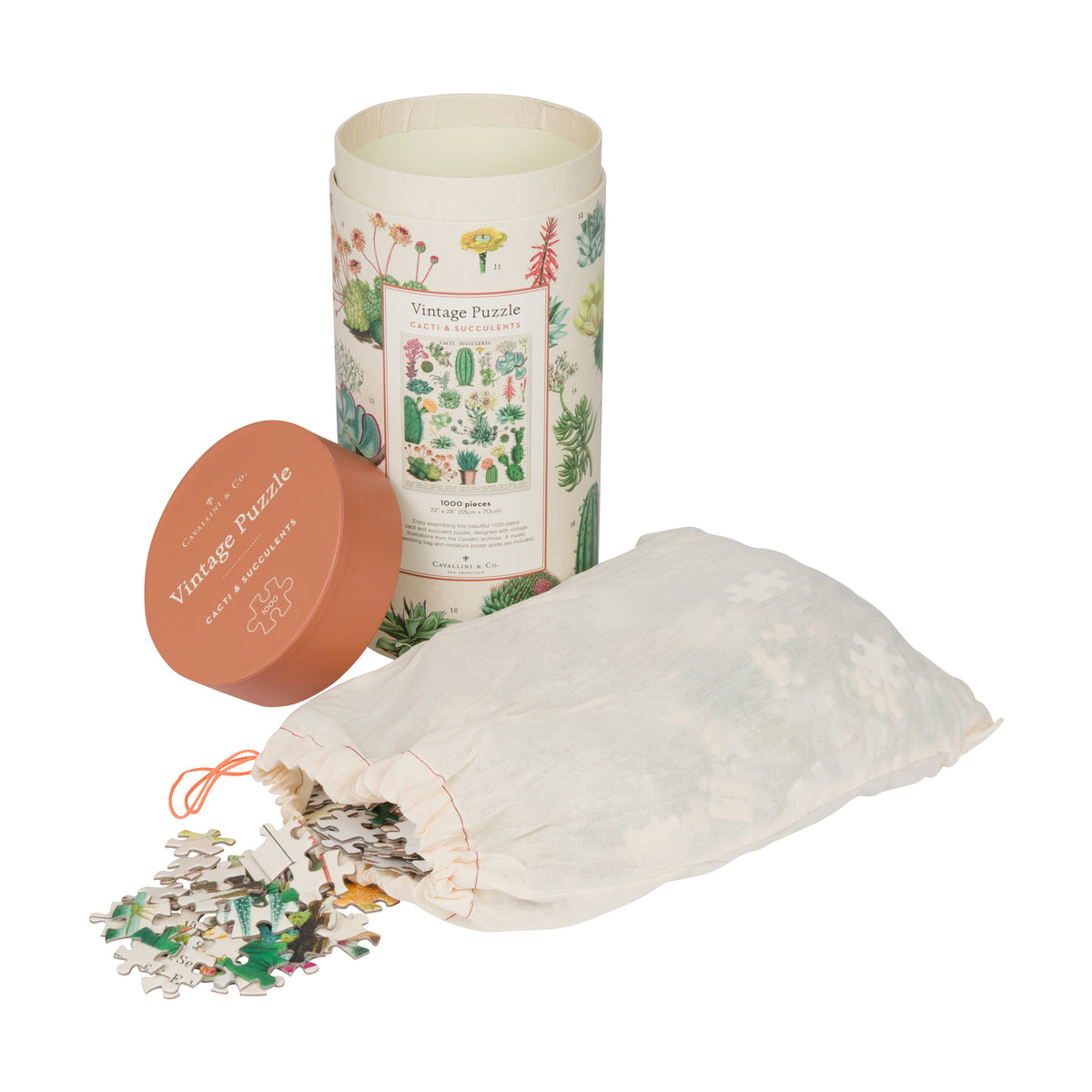 A vintage-style jigsaw puzzle set shown on a white background, including a cylindrical illustrated storage tin, a round terracotta lid, a white drawstring bag filled with puzzle pieces, and a small pile of cut puzzle pieces spilling out.
