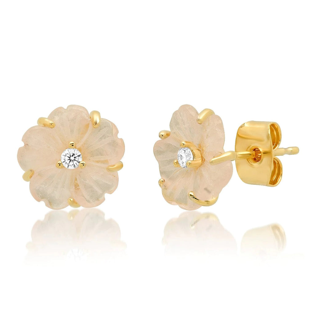Each pair of these pretty flower earrings are intricately hand carved so, just as with real flowers, no two blossoms are the same. The center is finished with a tiny crystal accent to add a delicate touch of sparkle. Materials: Mother of pearl, gold plating over brass, cz crystal Post fastening. Dimensions: 0.4" x 0.4"