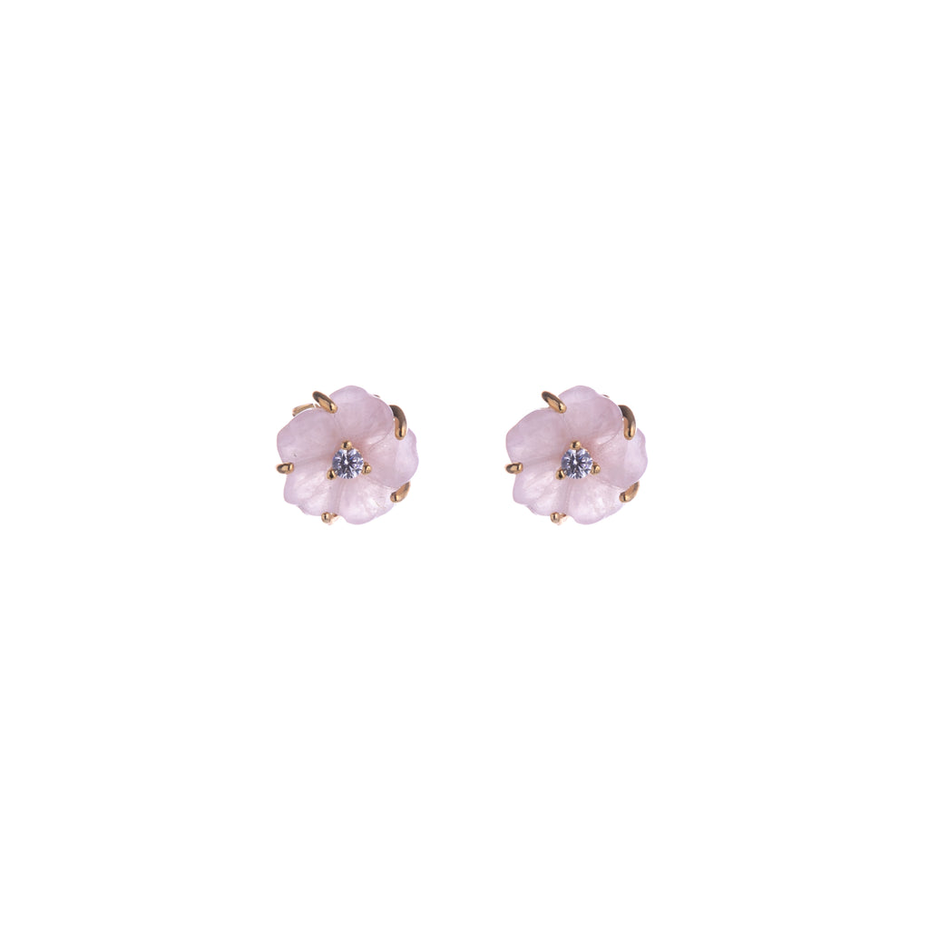 These intricately carved flower earrings in rose quartz add a dose of lovely pink and are subtle enough to wear daily. With a CZ accent in the middle, you will still sparkle and shine while showing off your love of those floral friends. Material: Gold-plated Brass, CZ Accent Dimensions: 0.2" x 0.2" Lead and Nickel-free