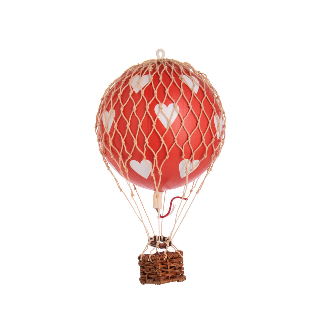 This detailed model hot air balloon evokes both the nostalgia of the past and the continued fascination with this amazing mode of transport. These balloons are ideal presents and make a beautiful decorative addition to any room. 5.3 inches x 3.3 inches. Hand woven netting and rattan basket. Comes with hanging wire.