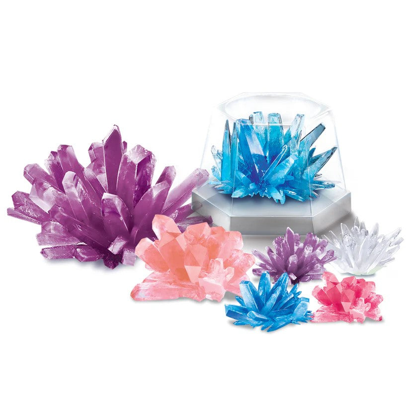 Grow your own crystals with this STEAM Crystal Science Kit! With this kit, grow crystals including one that glows in the dark and 2 pairs of geodes. In multiple colors and sizes, you have a wide variety to grow and become completely enamored with. Recommended age: 10+ Dimensions of box: Approx. 15" W x 11.5" H x 3.5"