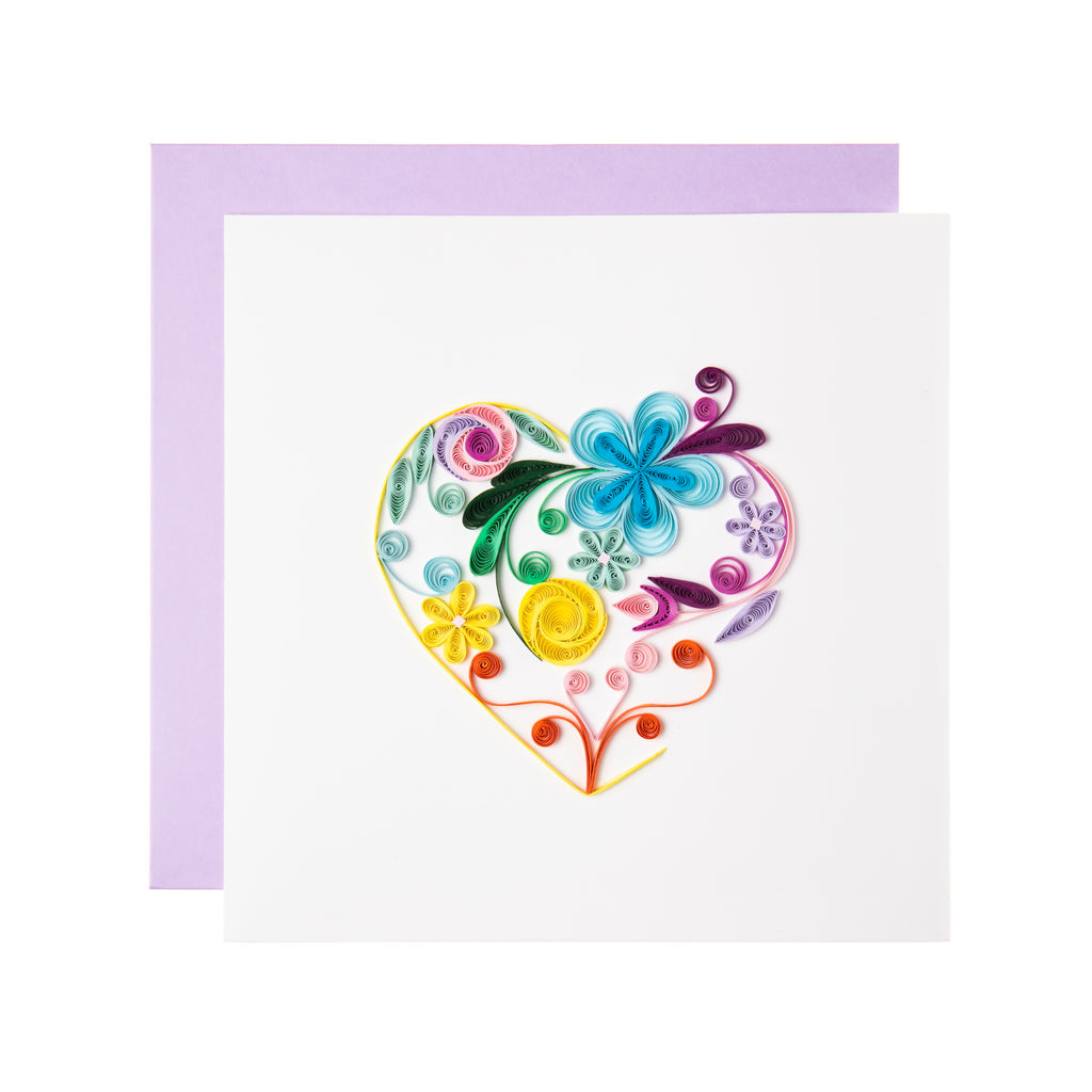 Tell your special someone how you feel with this beautiful greeting card. The Quilled Floral Rainbow Heart Card features an ornate floral heart with colorful swirls and multicolor flower petals. Handmade by a skilled artisan and takes one hour to create. Outside & inside copy: Blank.  6 in. x 6 in. Lilac envelope.