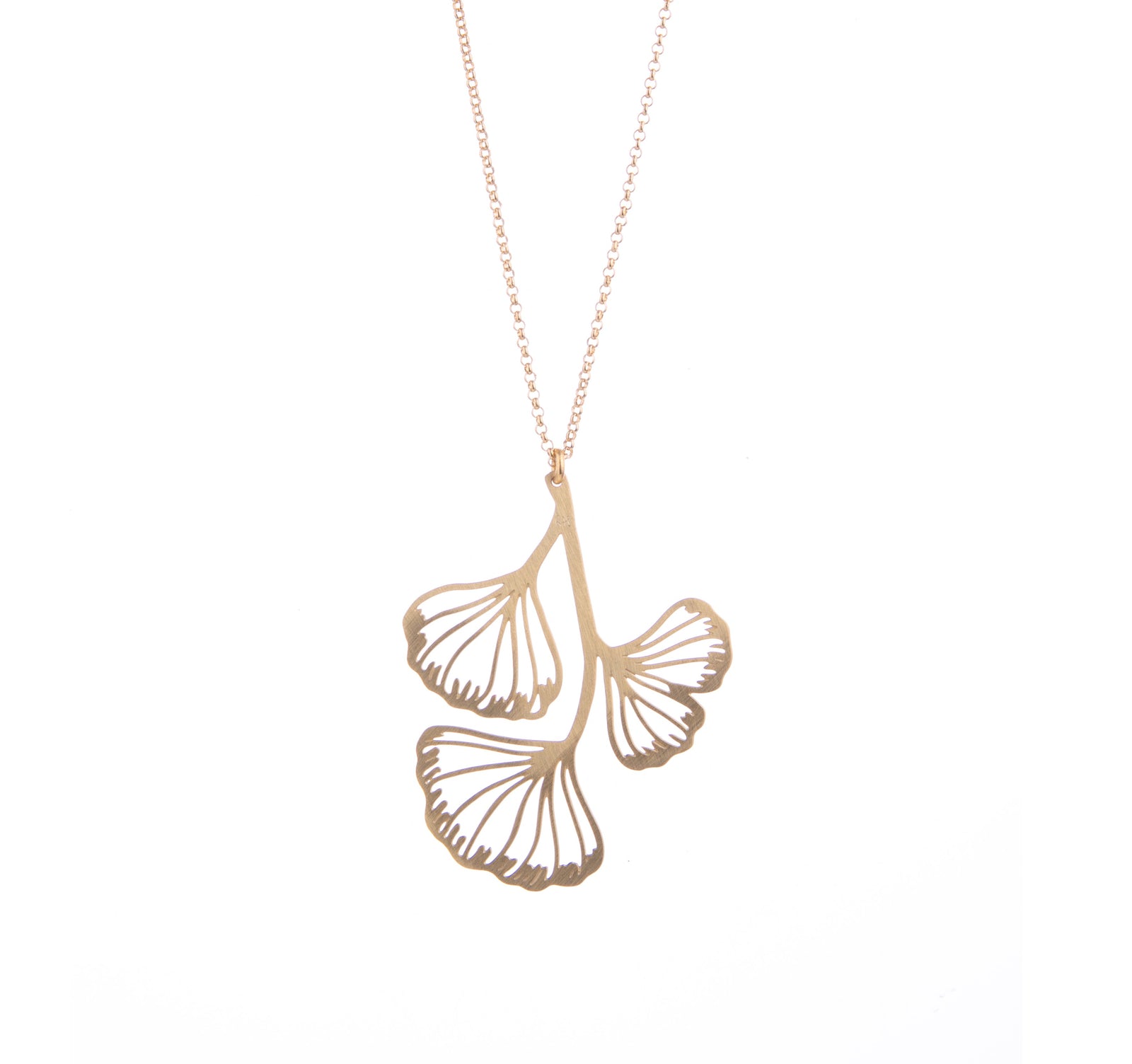 The fan-shaped ginkgo leaves are celebrated in this gold-plated necklace. This ginkgo necklace would look stunning as an addition to any outfit. Pair with other gold jewelry or wear on its own. Dimensions: Pendant - Approx. 1.5" x 2", Chain - Approx. 16"-21" Material: Gold-plated brass Nickel-free Made in Spain