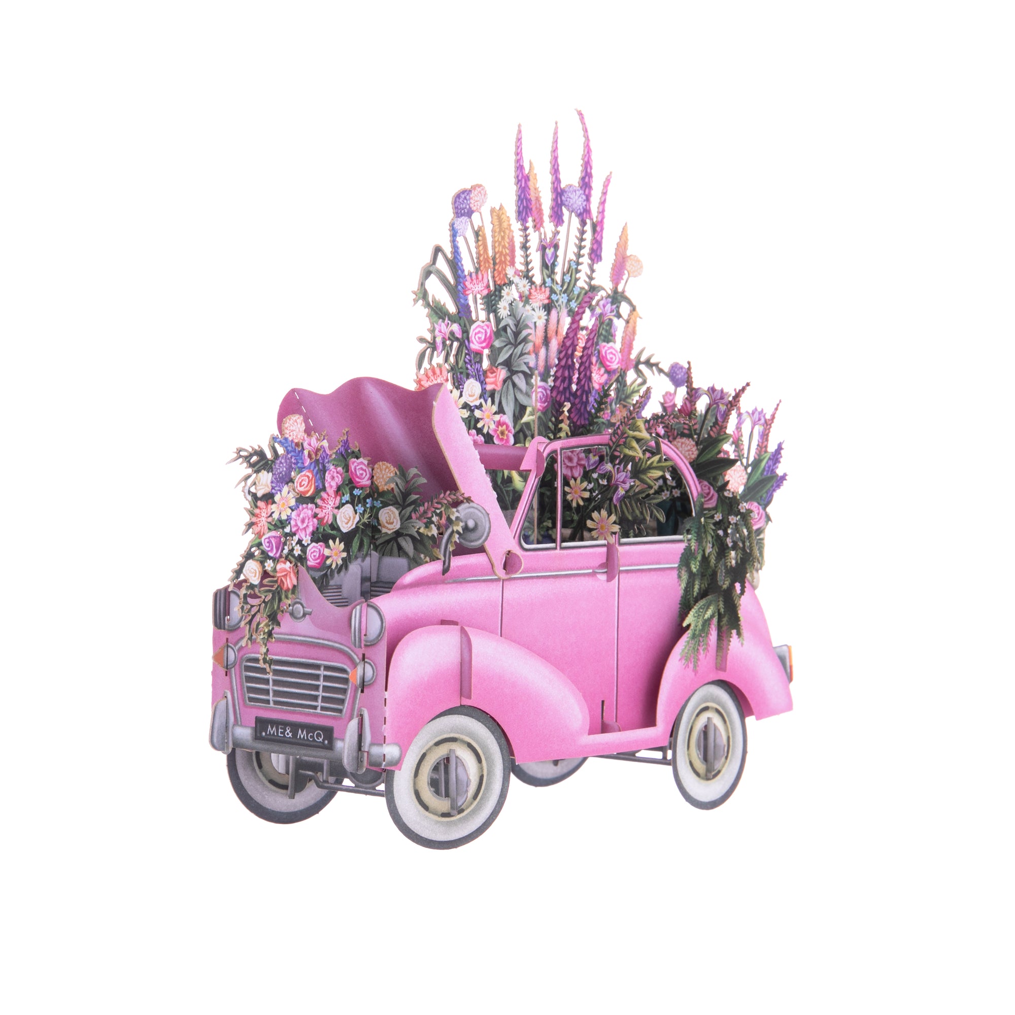 This 3D notecard features a vintage car with flowers growing out of it. With pink, orange, and purple flowers, this card is sure to brighten someone's day. The card can sit on a tabletop, and is blank for your own personal message. Dimensions: 6.5" x 6.5" Blank message tag for personal message Ivory envelope 