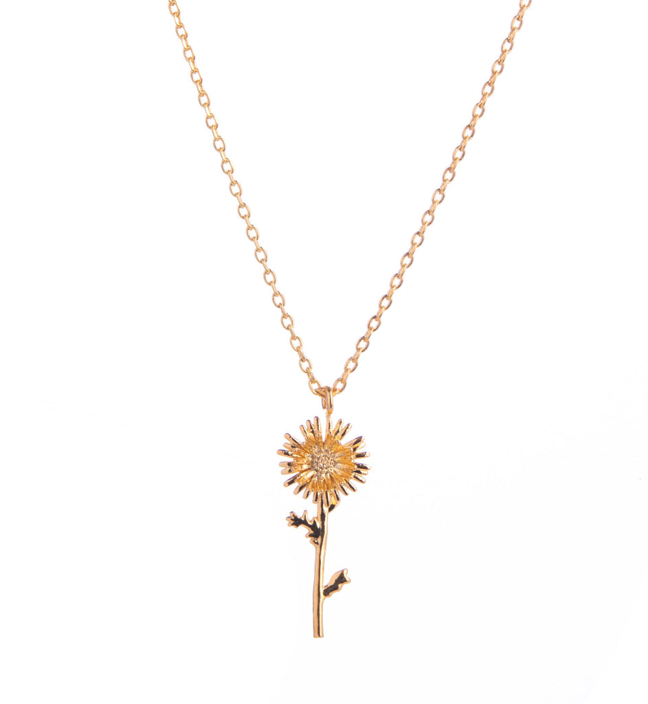 This stunning gold necklace features a pretty Aster in full bloom. With a delicate chain and shiny flower, this necklace is perfect for a pop of gold and will look great with a basic tee or with other gold jewelry. Dimensions: Pendant - Approx. 0.8", Chain length can be 16" or 18" Material: 14-ct Gold-plated Brass