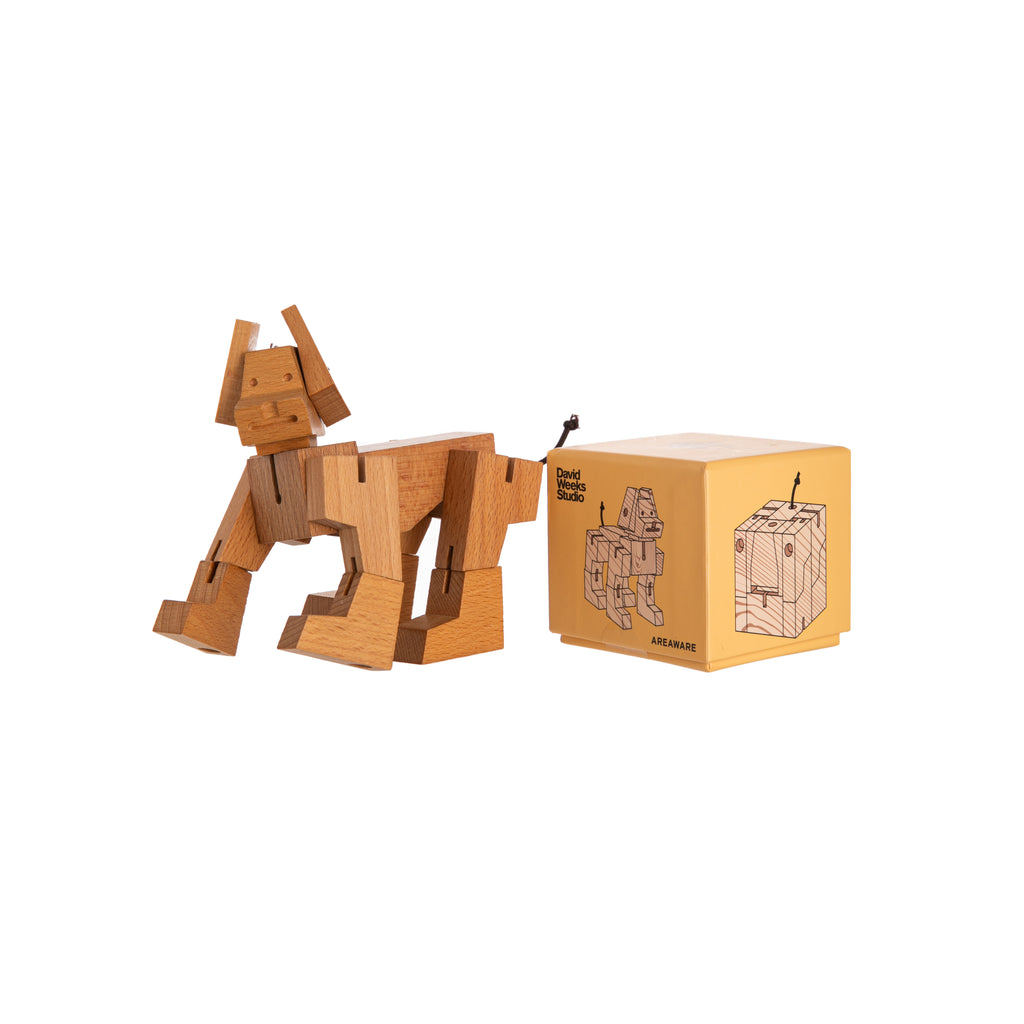 Milo Dog Cubebot® is a toy dog robot inspired by Japanese Shinto Kumi-ki puzzles. Made from wood and elastic, Milo can be folded into dozens of poses. When it’s time for a nap, Milo folds back into a perfect cube. Materials: beechwood and elastic Dimensions: 2.3" x 2.3" x 2.3" in a cube