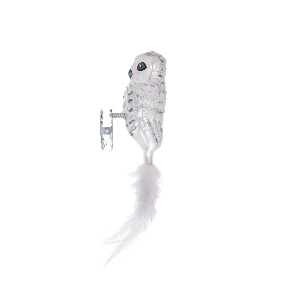 This glittery snow-dusted owl is made from hand-blown glass in a family-owned studio. Its tail is made with real feathers and has a hand-painted finish.