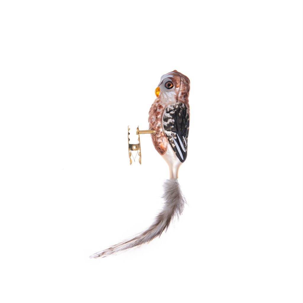 Not only is this brown owl a hoot, but it is made from hand-blown glass in a traditional family-owned studio in Limbach, Germany.  Its tail is delicately trimmed with real feathers, and it has a highly detailed, hand-painted finish.