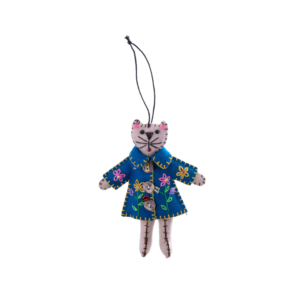 What could be cuter than a cat in a coat? This cat in a blue coat ornament is decorated with flowers for an adorable botanical detail. With additional beads and buttons, this stylish feline will look adorable hung up anywhere you decide. Dimensions: Approx. 5.5" L x 4.5" W Material: Felt, Beads