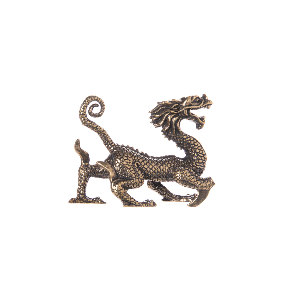 This miniature solid brass dragon figurine is intricately detailed, with a flowing mane, scales and claws.  A great addition to a New Year table centerpiece or as a lucky charm on your shelf or desk.  Solid brass miniature figurine. Dimensions: 2.5" x 2".