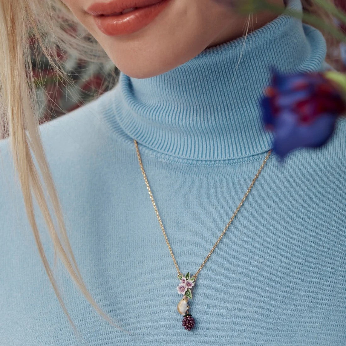 This Blackberry and Mouse pendant necklace adds a whimsical touch to your outfit and can be worn daily or as a statement piece. With floral detail and gold plating, this would be unique in any jewelry collection.  Material: Gold-plated enamel Dimensions: Approx. 1.3" pendant length, 16" chain length Lobster claw clasp