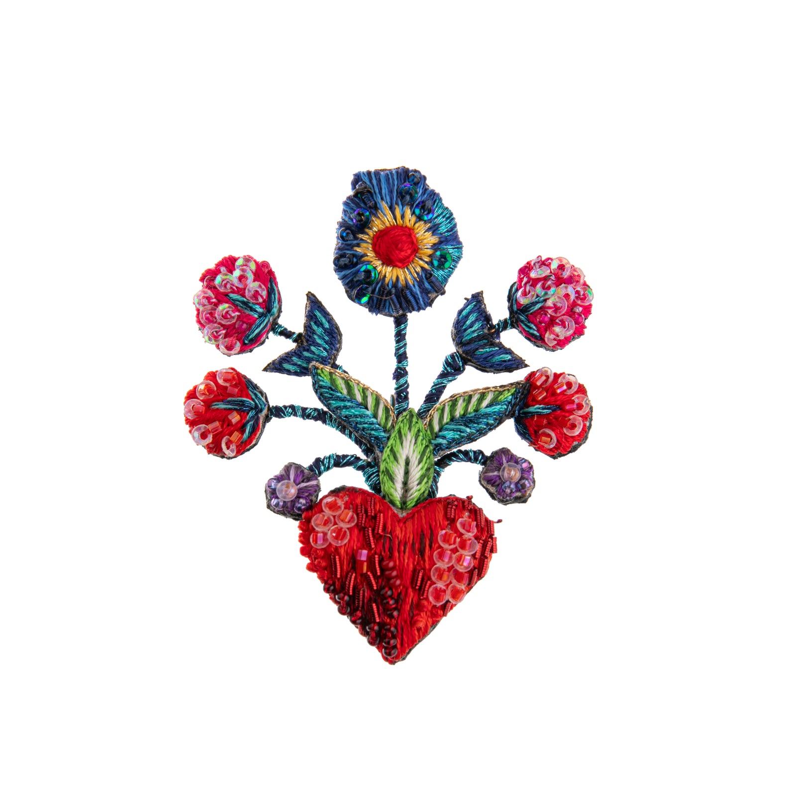 This brooch is inspired by Frida Kahlo and her flowers. This brooch pays tribute to her art and is hand-embroidered and beaded on a base of cotton and felt.