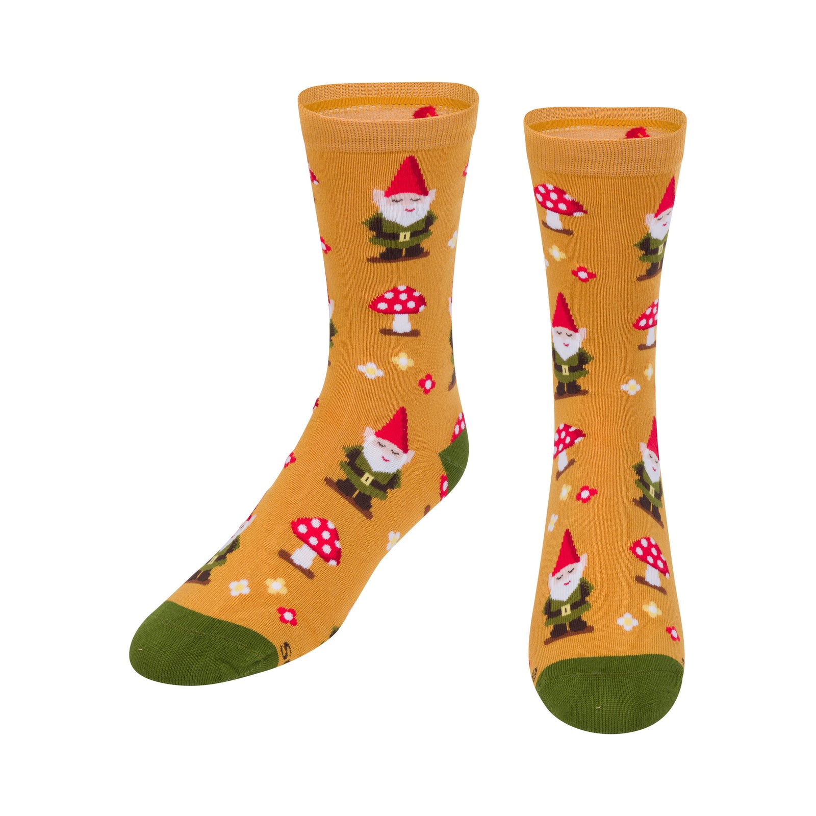 A pair of mustard yellow crew socks with a repeating pattern of garden gnomes, red-and-white mushrooms, and small white flowers, featuring solid green toes and heels, shown on a plain white background.
