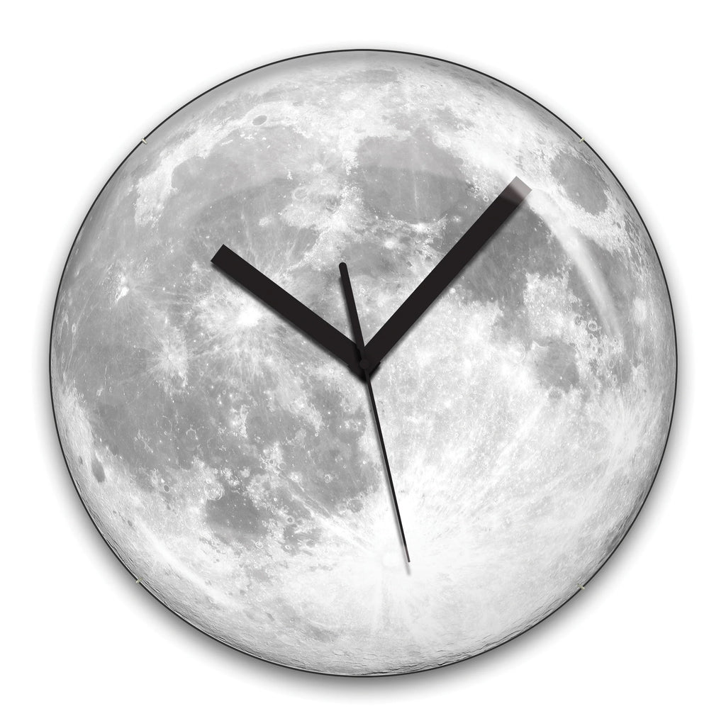 This Glow in the Dark Moon Clock is perfect for all luna lovers! Take home your slice of moon and illuminate your room with your own personal glowing moonlight.  This clock is made up of 65 different lunar images taken by an astronomy photographer. Dimensions: 13.5" x 13.5" x 1.5" Requires 1 AA battery (not included) 