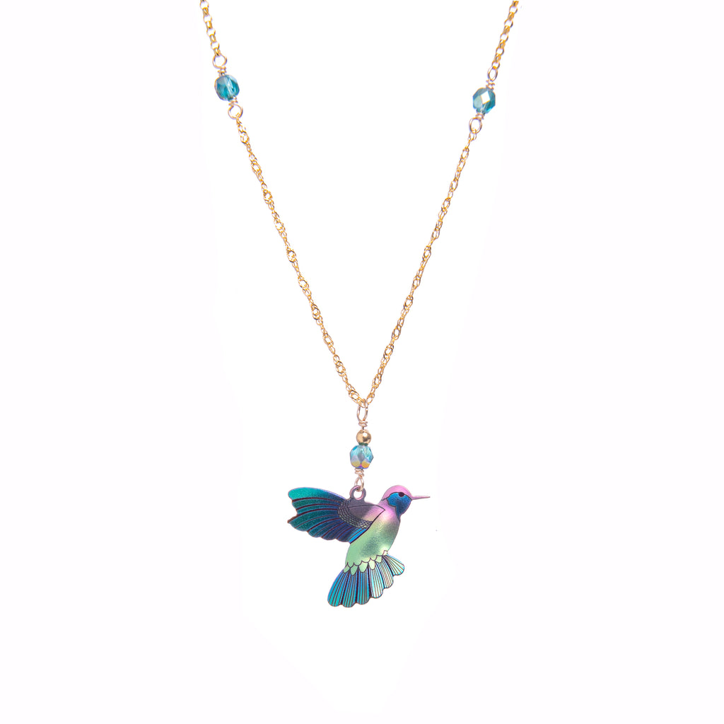 Hummingbirds have long been regarded as symbols of luck and messengers of love. They’re also quick as a flash. The radiant glow of niobium brings extra definition to the striking hues on this pendant, making it an alluring necklace to wear for any occasion. Adjustable chain: 16" to 20" Pendant size: 1.25" x 0.75".