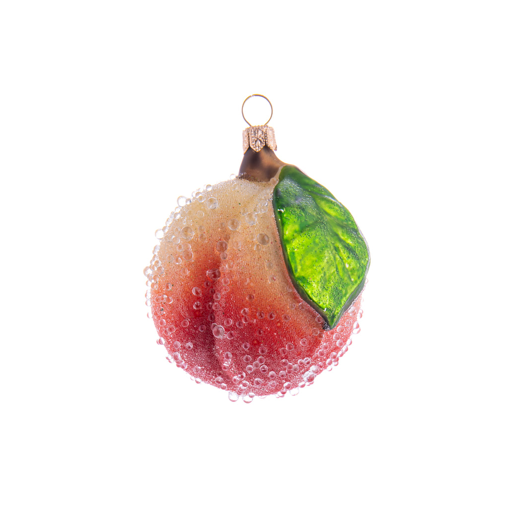 This Enchanted Peach ornament is so cute it will make you feel peachy keen! Coated with enchanted frosting to give it a glistening effect, this Enchanted Peach ornament is sure to be a charming addition to your home and holiday decor. Hand painted glass ornament Dimensions: 3.5" x 2.5"