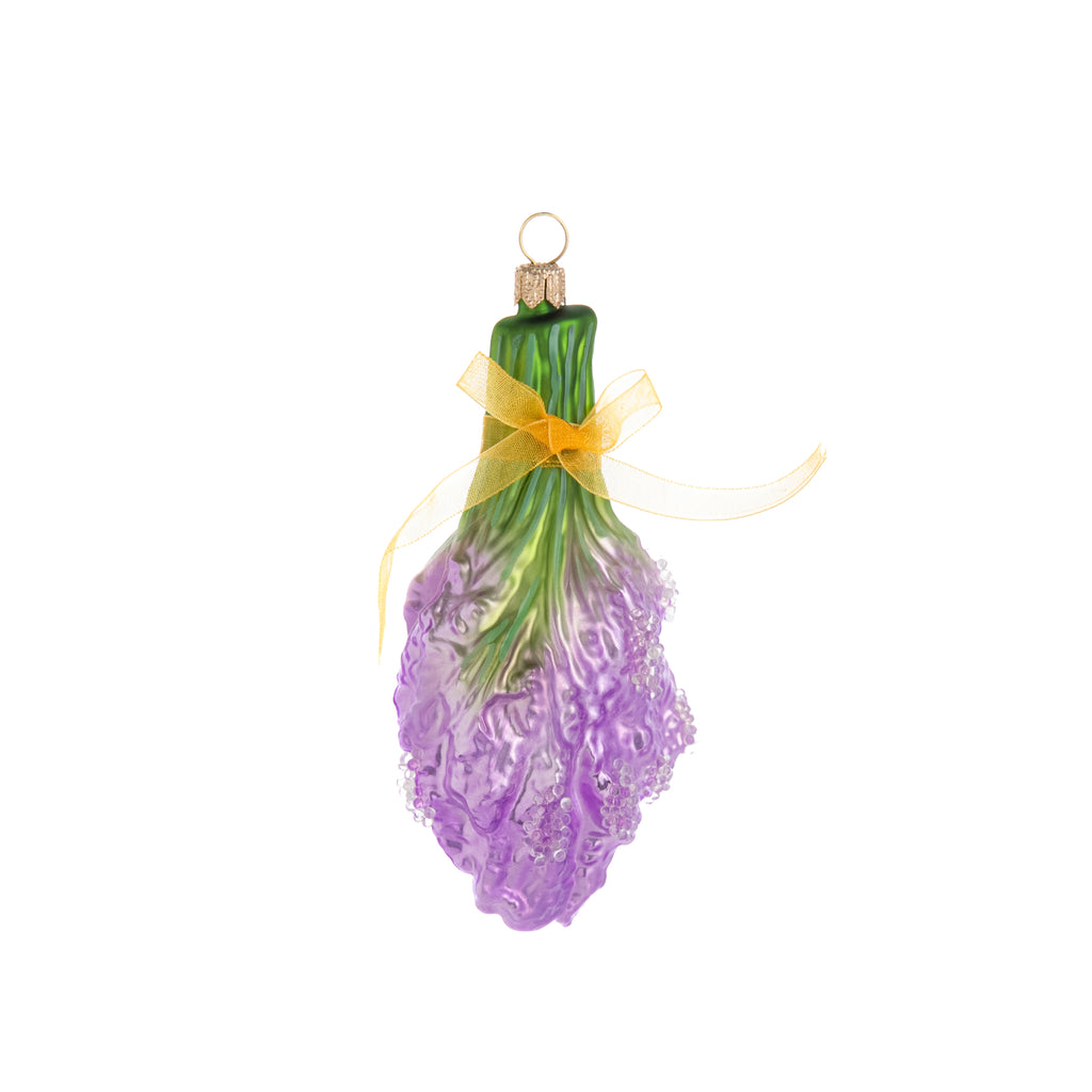 Evoke the mood of a summertime stroll through the rolling hills of Provence with this beautifully enchanting lavender bouquet ornament. This hand-finished glass ornament is finished off with a gold organza ribbon bow. Hand finished glass ornament. Dimensions: 5" x 2.25".